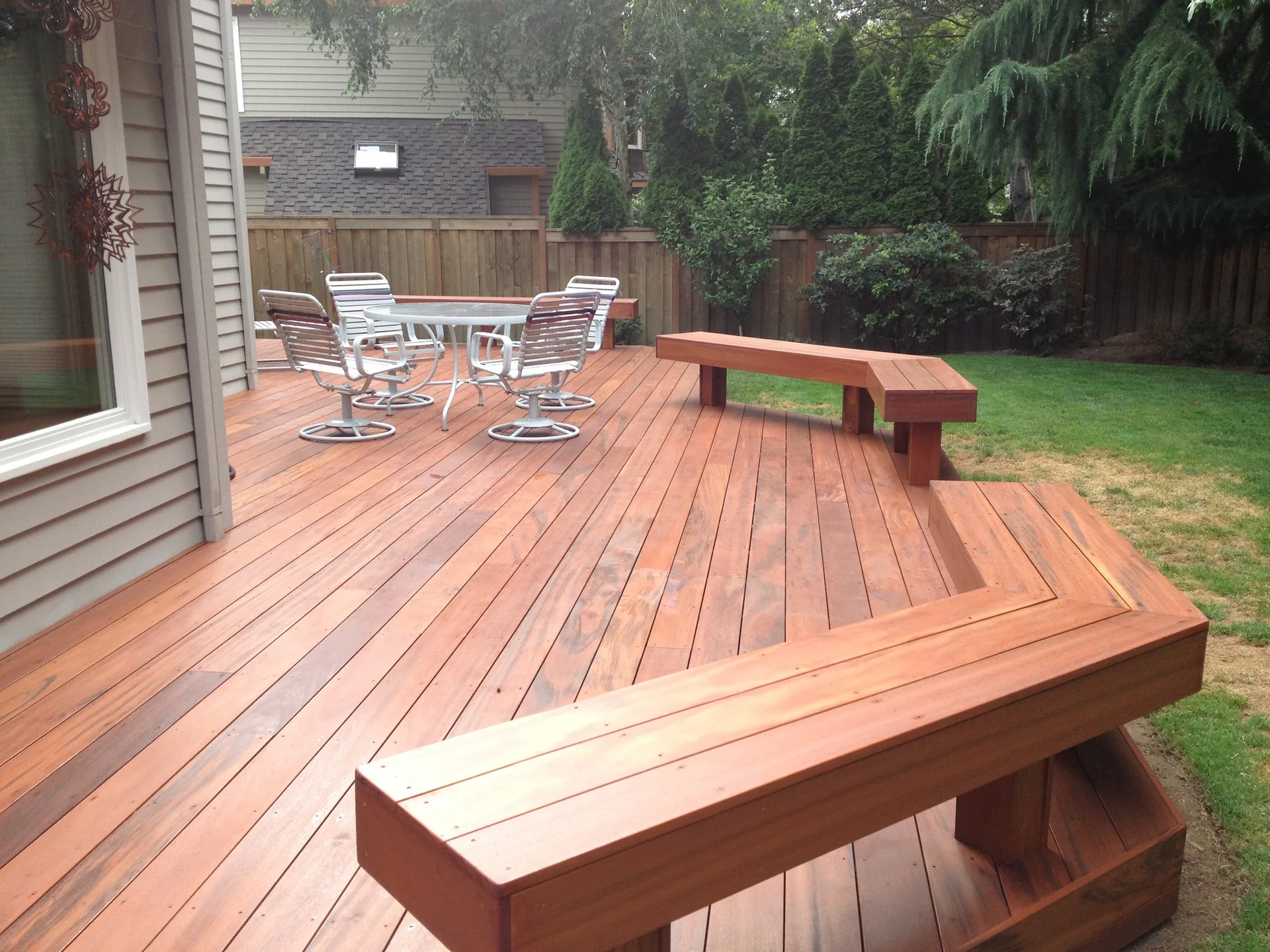 Finished hardwood deck with integrated bench seating