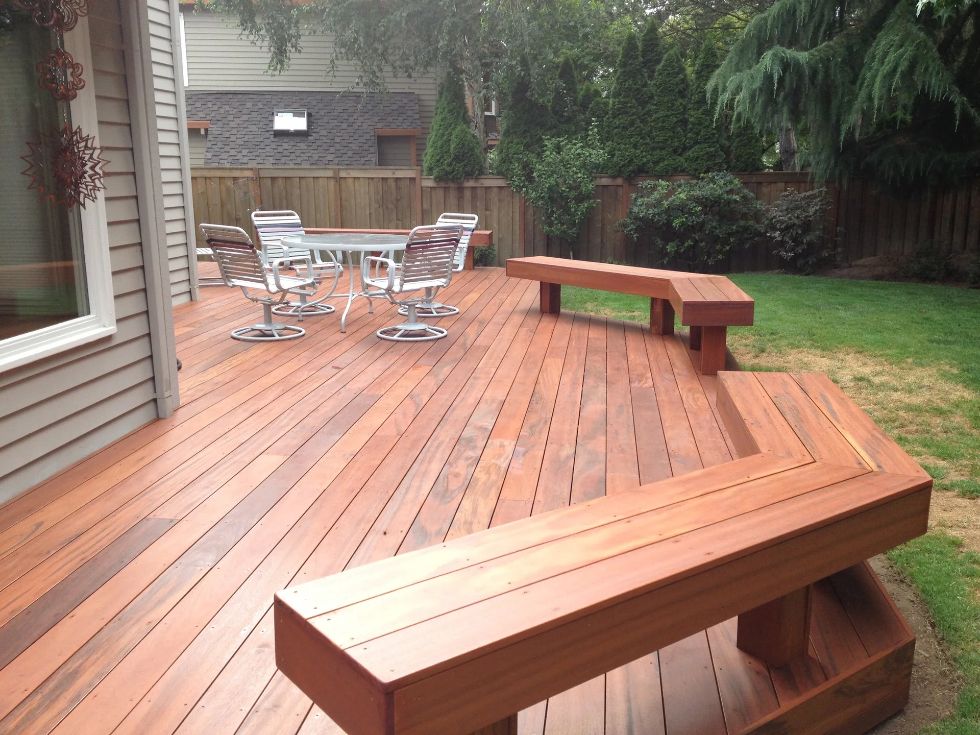 Finished hardwood deck with built-in bench seating
